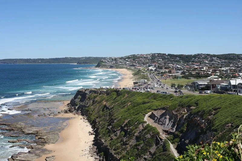 The Newcastle coast from the clifftop above Bar Beach, the surf breaking along the sand
