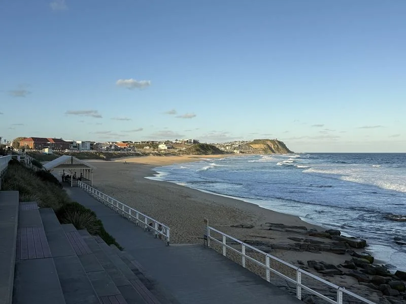 Merewether Beach on a summer afternoon, surfers in the water