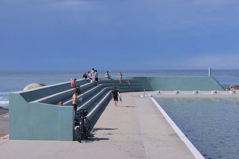 The aqua bleachers and numbered starter blocks at Newcastle Ocean Baths